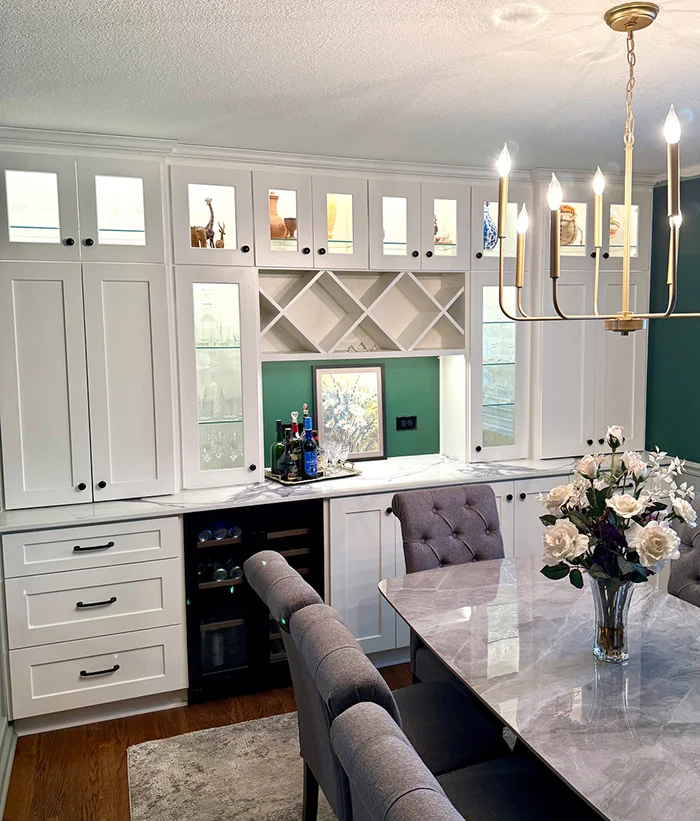 Dining room remodel with marble table and built-in display cabinetry by Stag Homes Design-Build in Kansas City